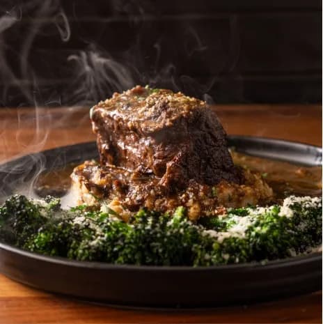 Braised beef served with vegetables at Crust Simply Italian