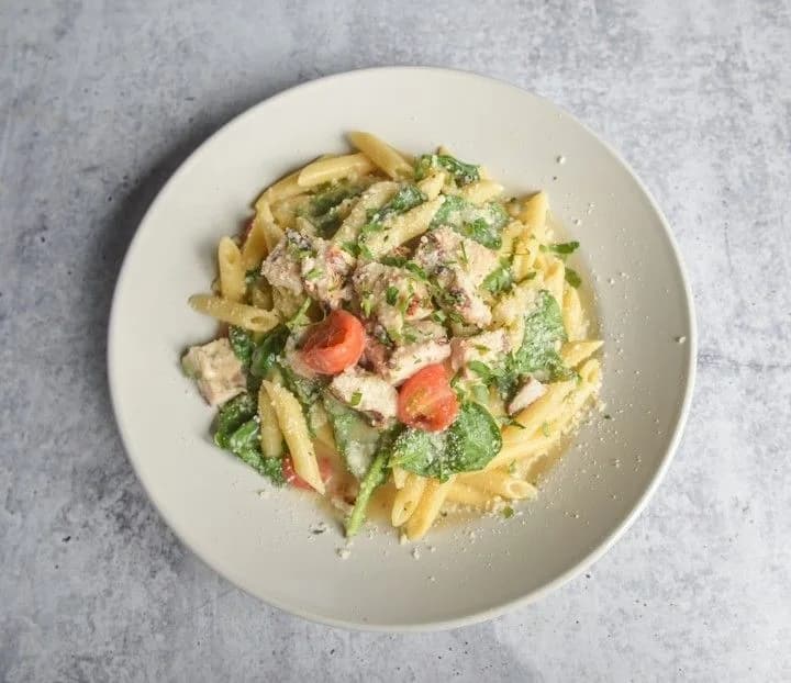 Penne pasta with vegetables and grated cheese from Crust Simply Italian